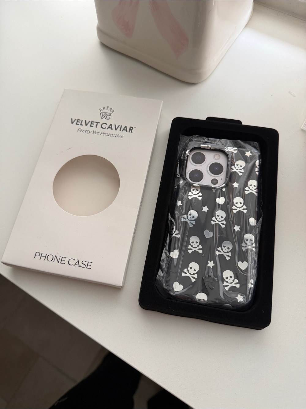 Velvet Caviar iPhone 15 pro Case with White Skulls & Hearts